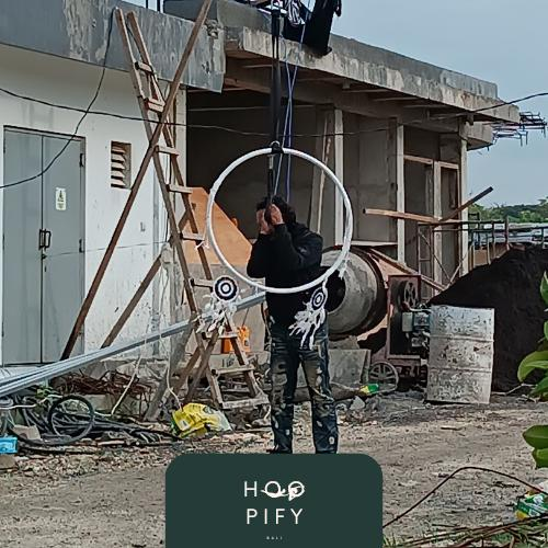 Hoopify Bali craftsman fitting an aerial hoop in the workshop